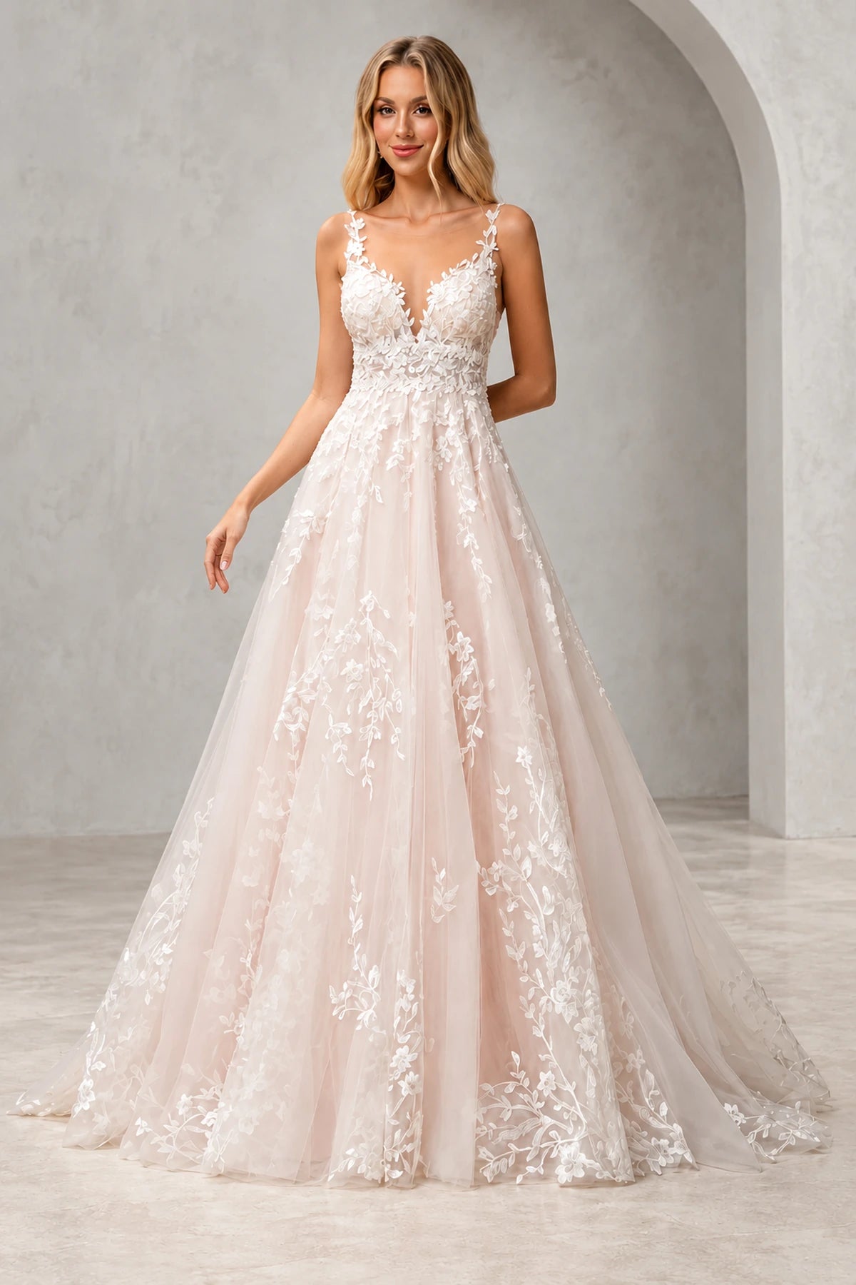 Back view of Vedress floral lace tulle wedding dress featuring a deep scoop back, covered buttons and a flowing train.